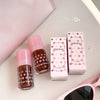 Two nail polish bottles with pink caps and boxes labeled 'Gege bear' on a light background.