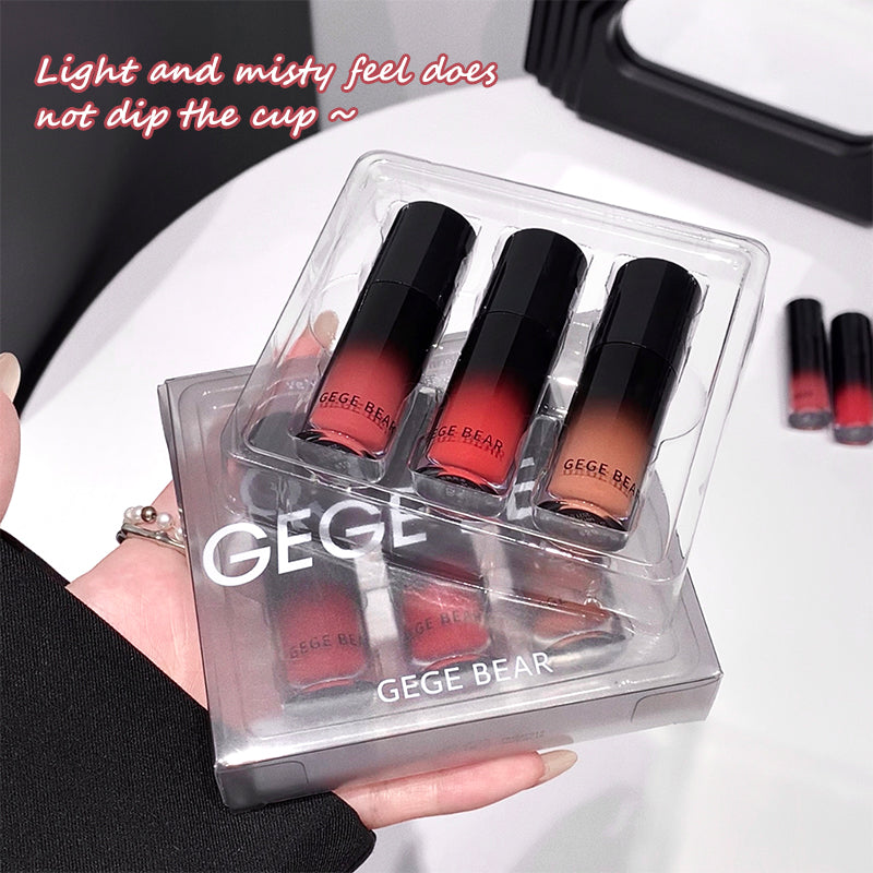 Set of GEGE BEAR lipsticks in a clear case held by a hand.