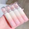 Set of pink and white lip glosses with 'gegebear' branding on a light background