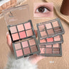 Makeup palette with pink and brown shades held by a hand, with an inset of eye makeup application.