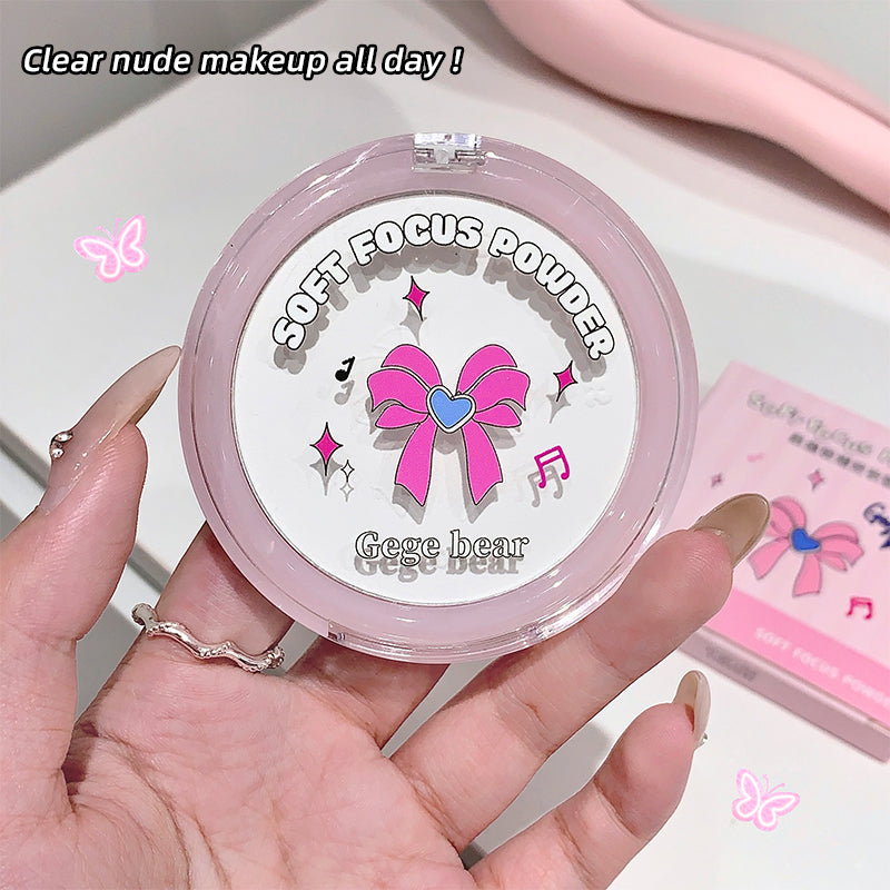 Hand holding a compact powder with a pink bow design and 'Gege bear' branding.