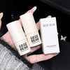 Hand holding two 'GEGE BEAR' highlight sticks and their packaging against a dark background.