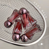 Pink and clear dog toys on a metal grid with 'Gege Bear' branding.