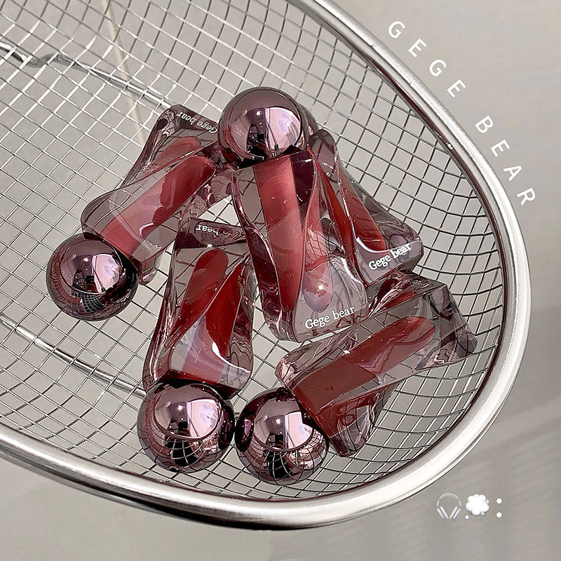Pink and clear dog toys on a metal grid with 'Gege Bear' branding.