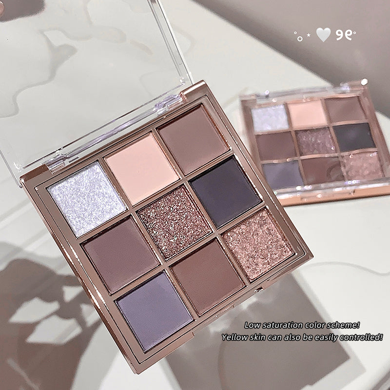Makeup eyeshadow palette with various shades on a light background