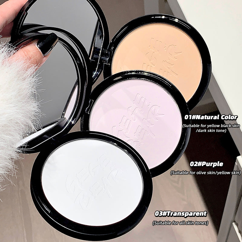 Three compact powder cases with different shades held by a hand.