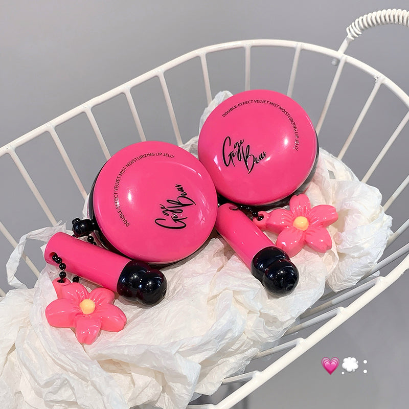 Pink lip balm with floral designs on a white chair