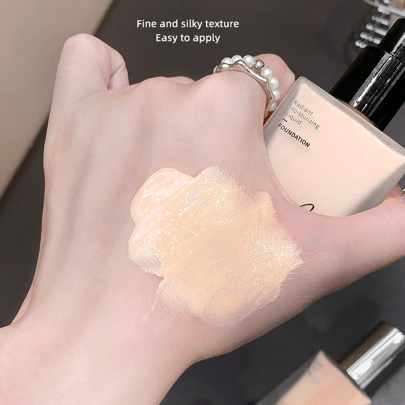 Hand holding a swatch of foundation with text about texture and application ease