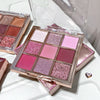 Makeup palette with pink and purple shades on a white background