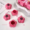 Pink flower-shaped containers with 'Gege bear' branding on a white surface.