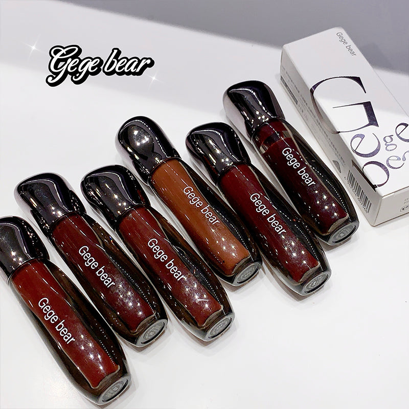 Set of Gege bear lip glosses with packaging on a white background