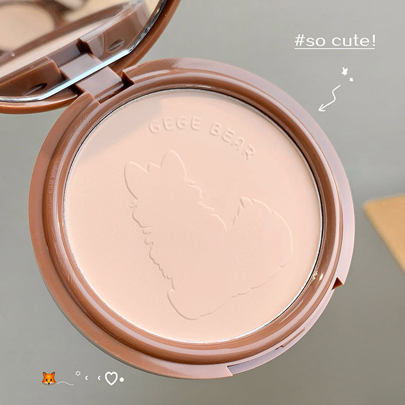 Compact powder with a cat design on the lid, branded 'Gige Bear', on a neutral background.