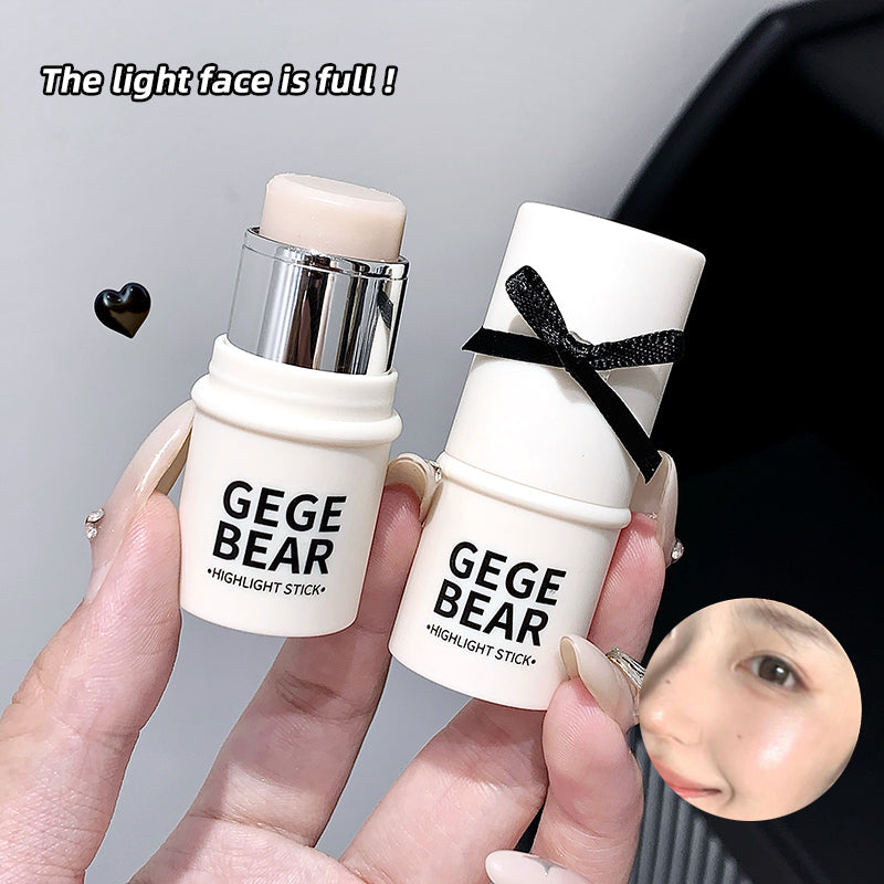 Two GEGE BEAR highlight sticks held by a hand with a blurred face in the corner.