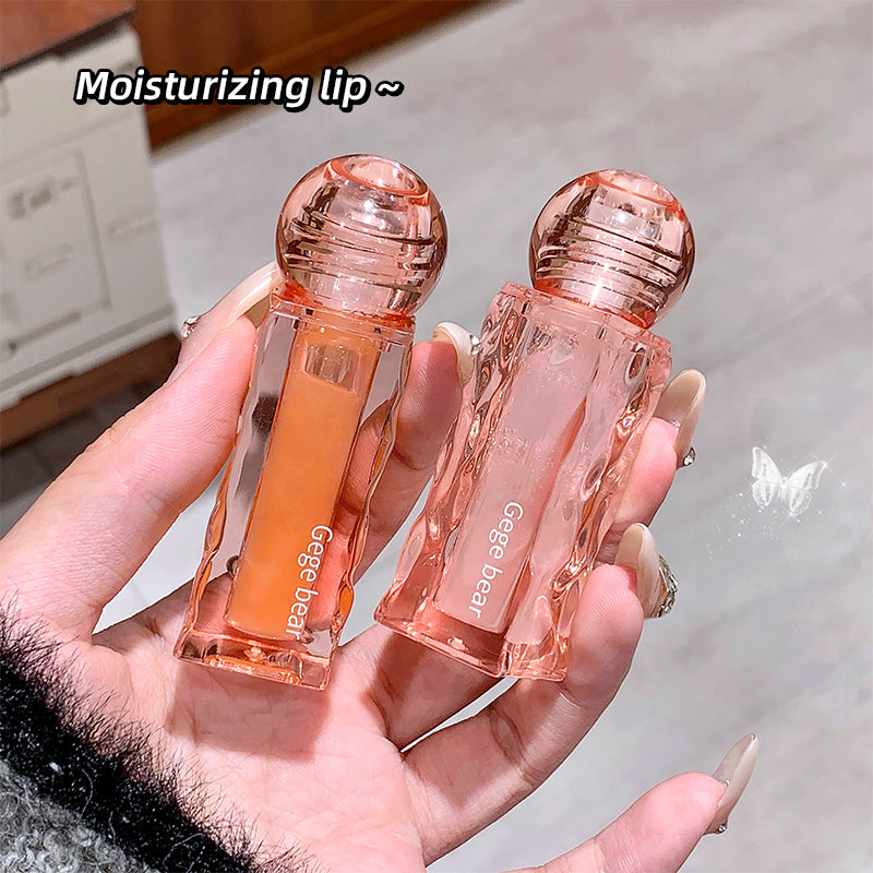 Two lip products held in a hand with 'Gee Bear' branding.