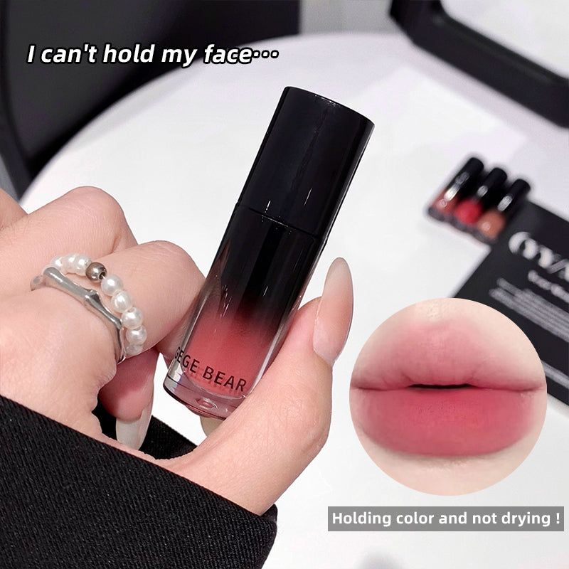 Lipstick held by a hand with an inset of lips wearing the color, and text indicating holding color and not drying.