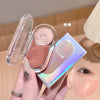 Hand holding a blush cream with a close-up of a person's face showing blush application.