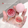 Lip balm and container with red substance held by a hand, labeled 'Sugar-stained Fresh Fruit' and 'Pure desire to feel juice!'.
