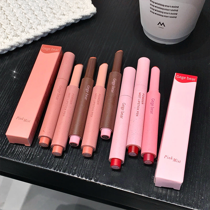 Set of lip products including lipsticks and lip glosses on a dark surface with 'Gege bear' branding.