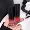 Two lip products with gradient design held by a hand, brand 'GEGE BEAR' visible.