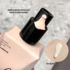 Foundation bottle with pump head and liquid sample on a blurred background