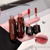 Lip gloss with 'Gege bear' branding held in a hand, showing a close-up of lips with the product.
