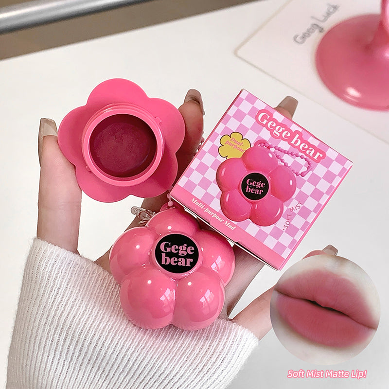 Pink flower-shaped makeup product with 'Gege bear' branding, held by a hand.