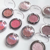 Multiple compact blushes with visible brand name on a light background