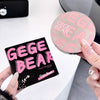GEGE BEAR makeup product packaging held by a person