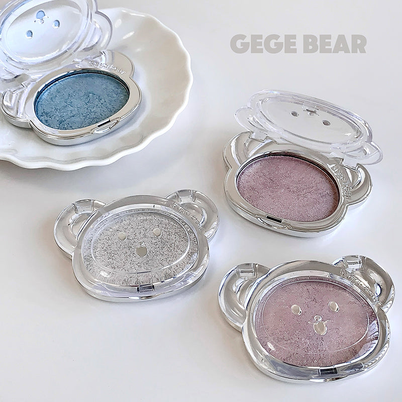 Makeup products with bear-shaped cases on a white background, featuring the brand 'GEGE BEAR'.