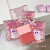 Makeup product with cartoon character design on a white surface