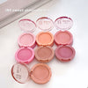 Compact blushes with 'G.E. BEAUTY' branding on a white surface.