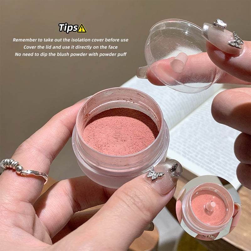 Person holding a container of blush powder with tips on usage.