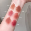 Color swatches of a makeup product on a person's arm with labeled shades.