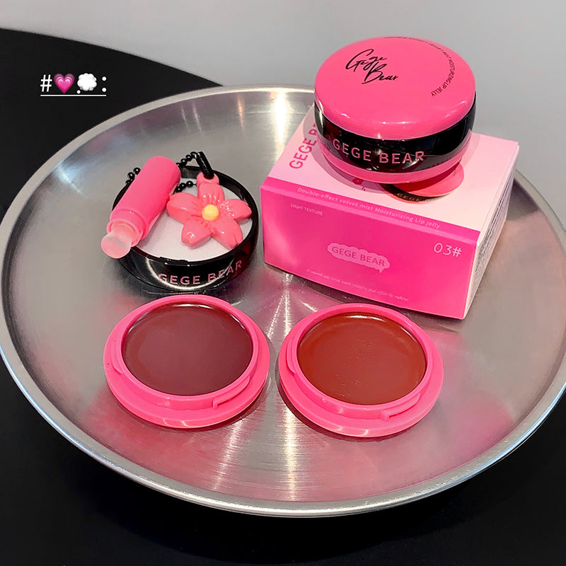 Makeup products with pink and brown shades on a metallic tray, featuring 'GEGE BEAR' branding.