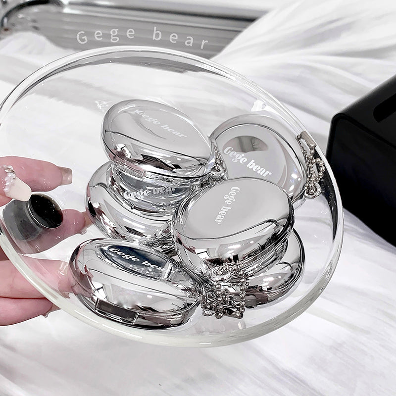 Clear containers with 'Gege bear' branding on a white surface