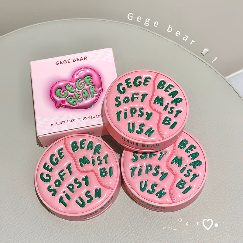 Pink cosmetic products with 'GEGE BEAR' branding on a light gray surface.