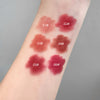 Lipstick swatches on a person's arm with color names labeled