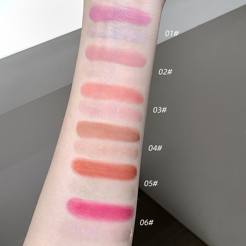 Lipstick swatches on a person's arm with color codes