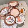 Compact powder with cartoon fox design on a neutral background