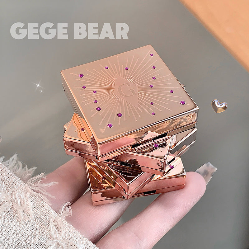 Rose gold compact powder case held in a hand with 'GEGE BEAR' branding.