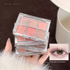 Makeup palette with blush shades held by a hand, with an inset of an eye wearing the makeup.