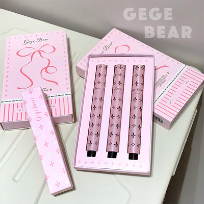 Set of pink nail art tools with 'GEGE BEAR' branding on a light surface.