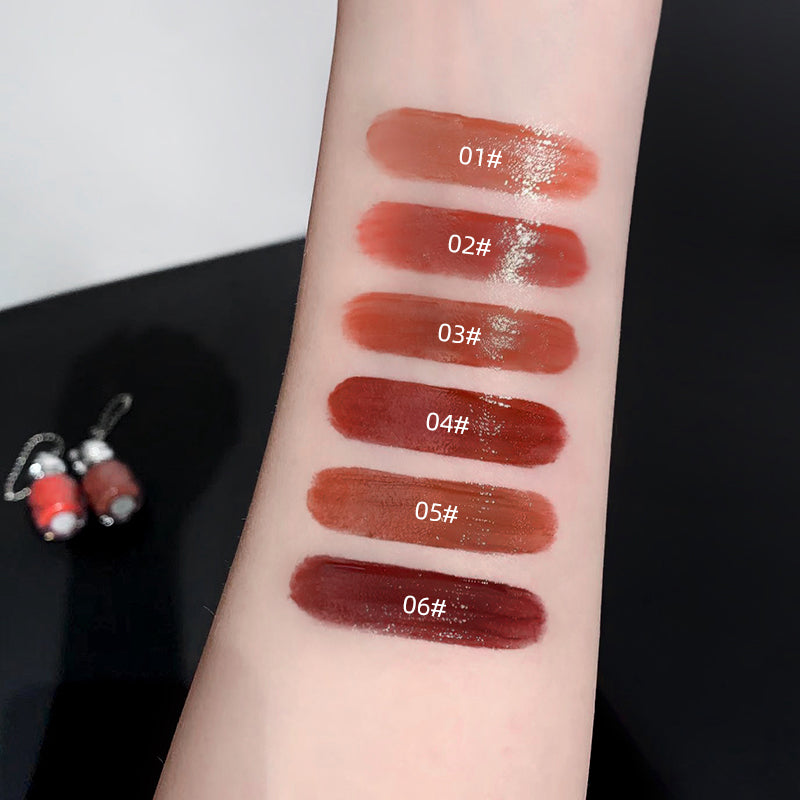 Lipstick swatches on a person's arm with color codes