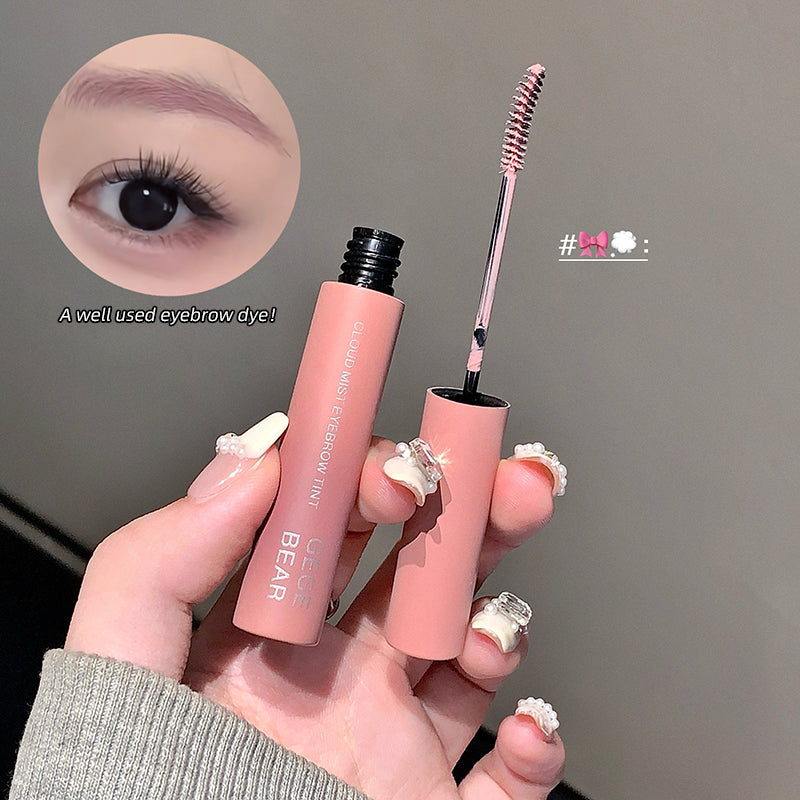 Two pink eyebrow products held by a hand with a close-up of an eye wearing the product.
