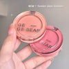 GE GE BEAR blush compact held in a hand with a neutral background