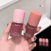 Two Gege bear lip and cheek multi-purpose creams held in a hand with a neutral background.