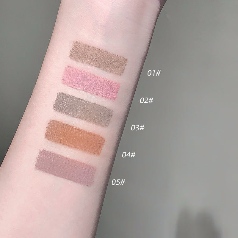 Color swatches on a forearm with labeled shades against a neutral background