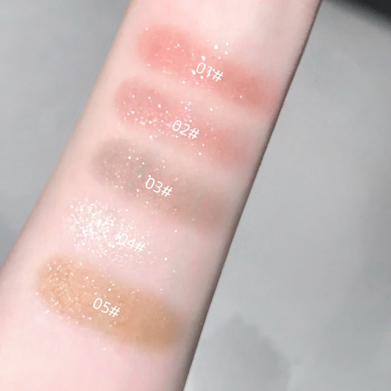 Color swatches on a person's arm with labeled shades.