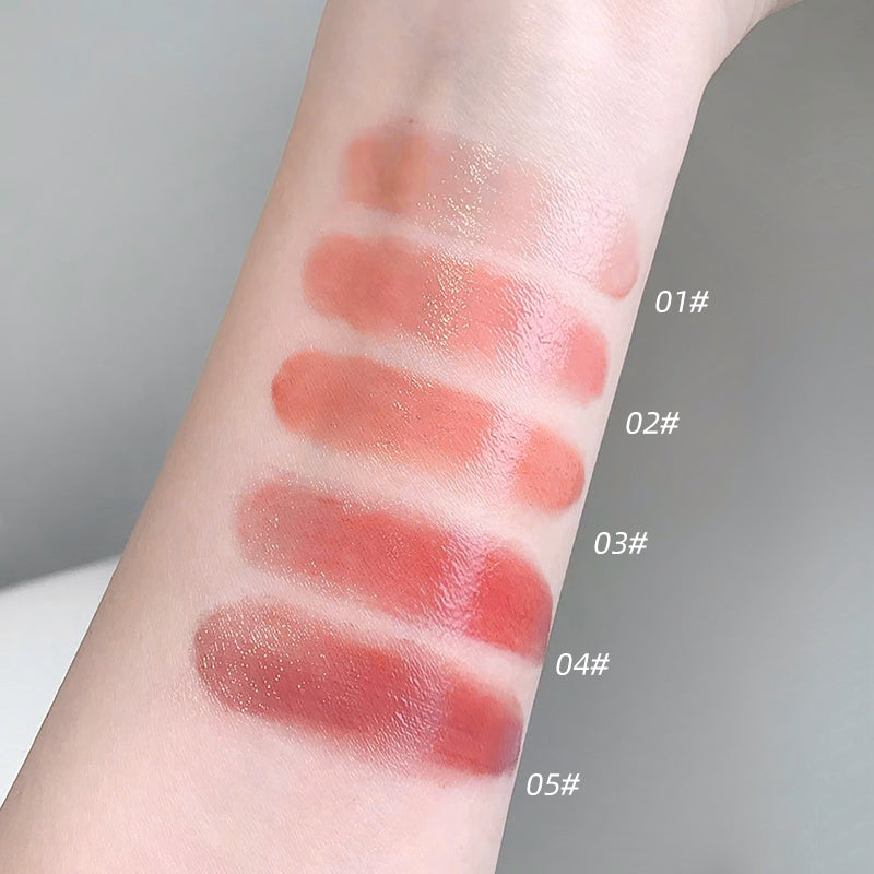 Lipstick swatches on a person's arm with color codes