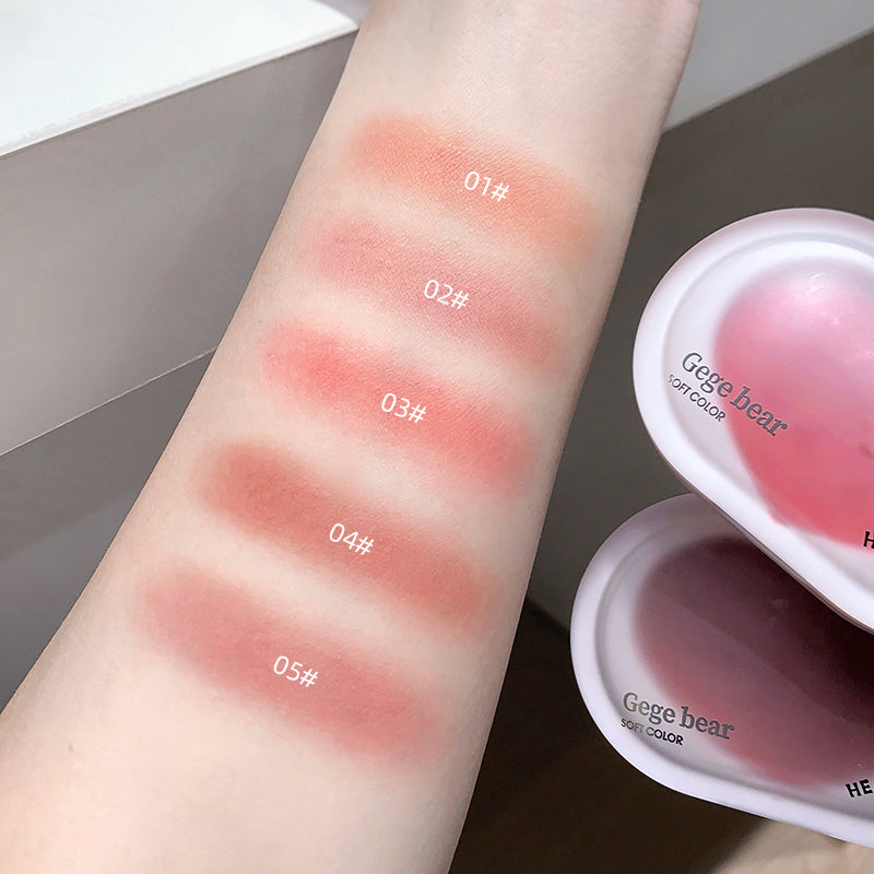 Color swatches on a wrist with 'Gegebear' blushes labeled from 01# to 05#, with product packaging visible.